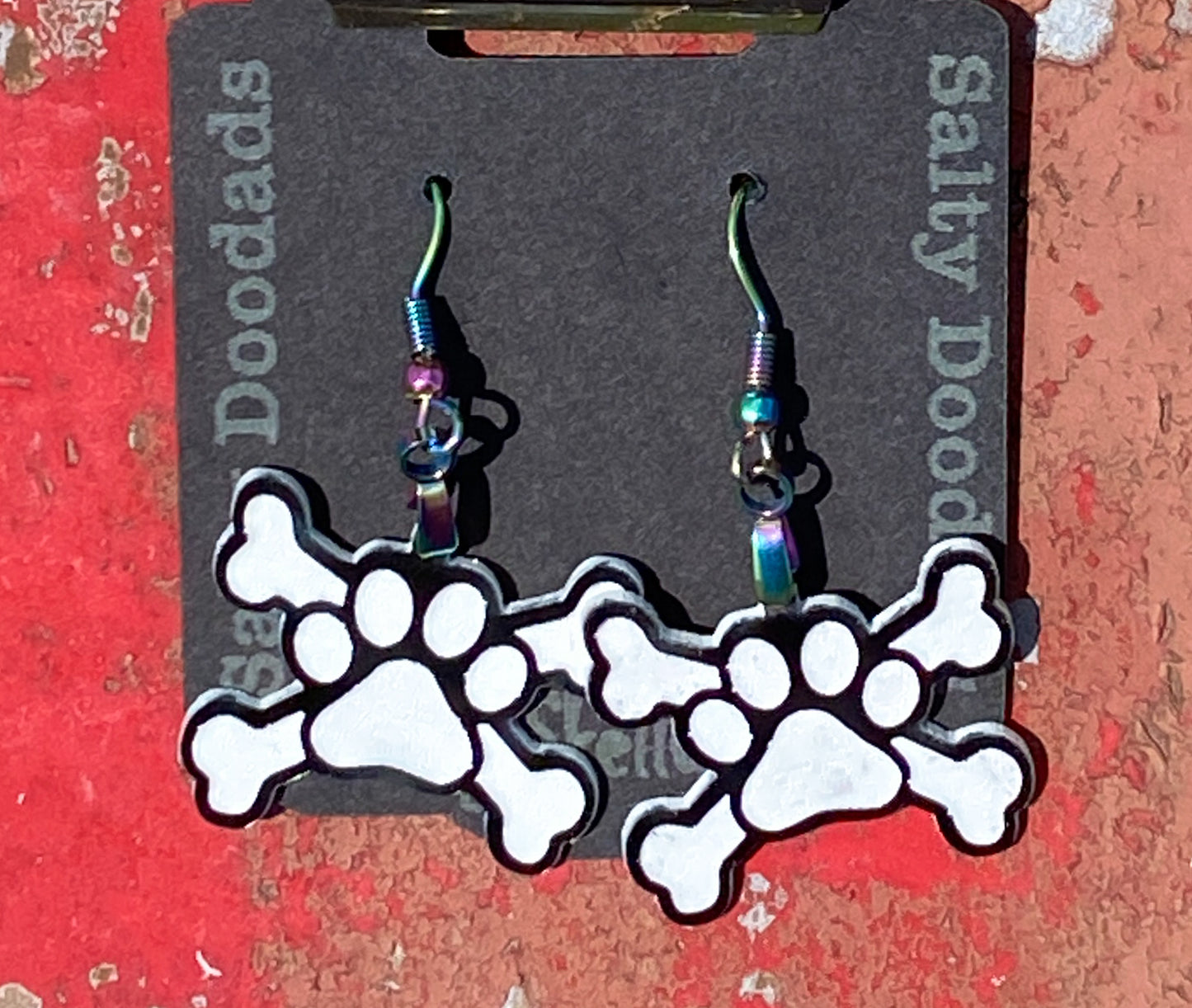 Paw Print Cross Bones Halloweener Skeleton Dangle Earrings - The Salty Lick Mercantile